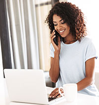 Young woman on phone and laptop