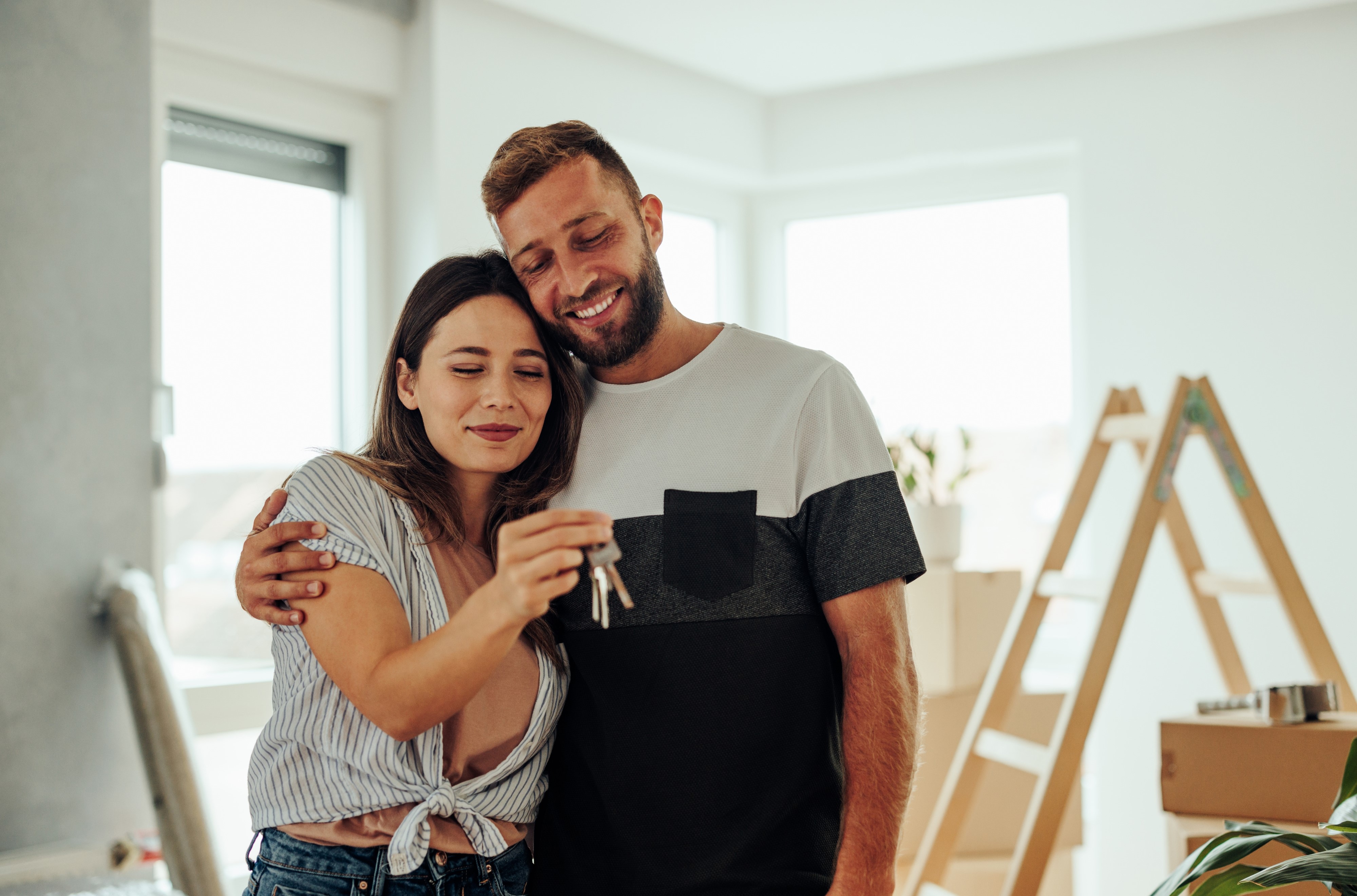 Young couple holding keys
