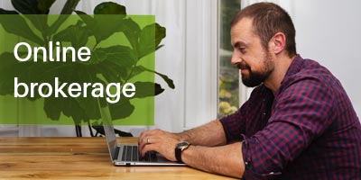 man investing online at home