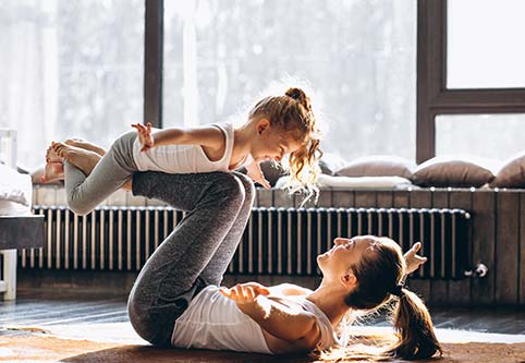 mother and daughter play at home