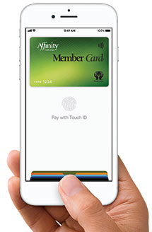 Apple Pay hand with iphone and Apple Pay and MemberCard showing